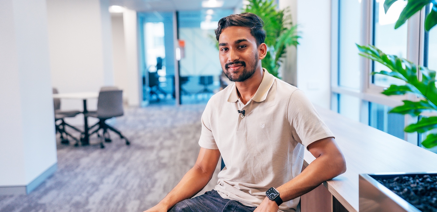 Photo of Abdullah Riyad, Bachelor of Business student sitting in a common area at Charles Sturt University Sydney