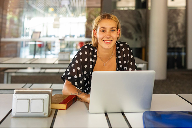 Australian student laptop smiling