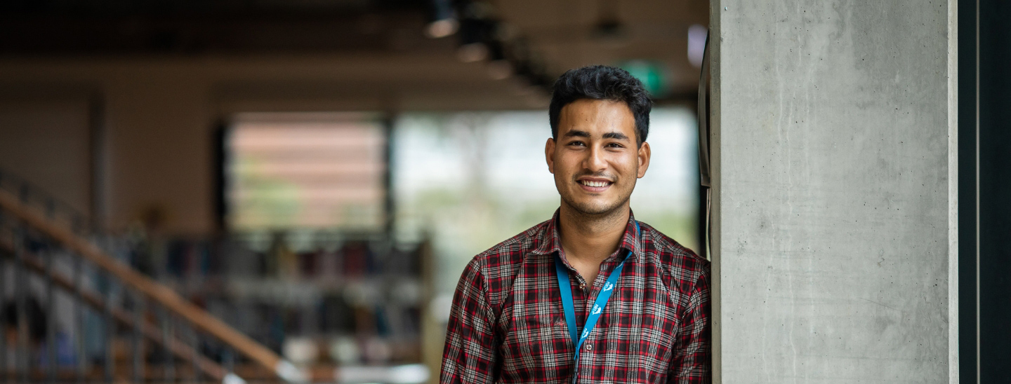 Male student happy on campus