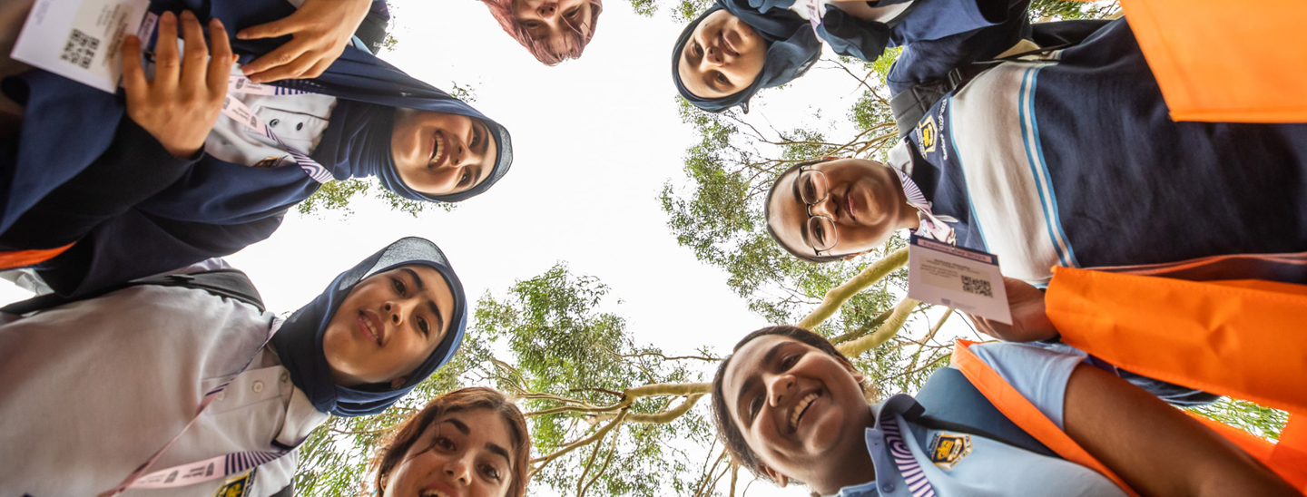 Students standing in circle at explore day