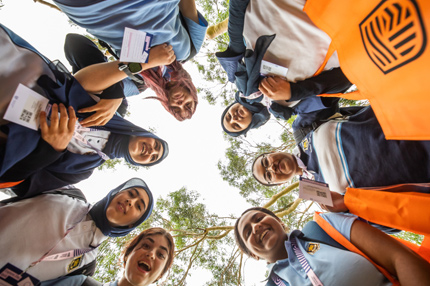 Students standing in circle explore day