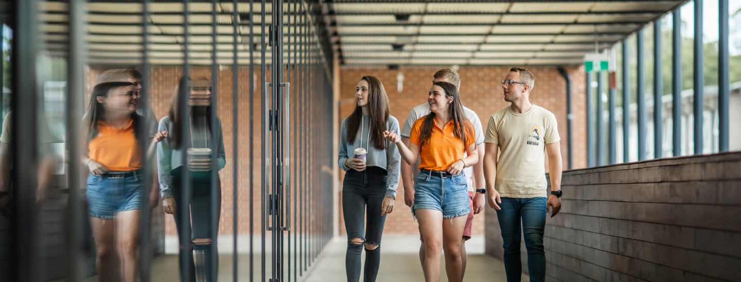 Students walking outside on campus